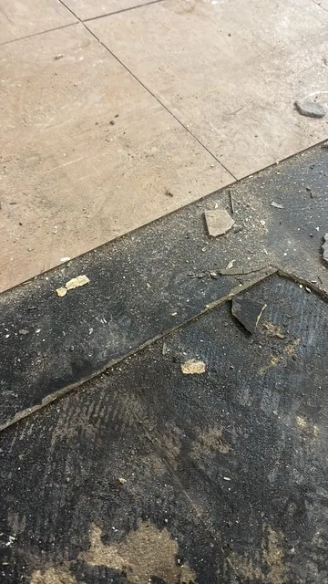 Black bitumen mastic floor removal in a SE28 flat